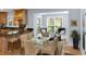 Cozy breakfast nook featuring bright windows and adjacent access to the fully equipped kitchen at 65 Surfsong Rd, Kiawah Island, SC 29455
