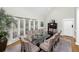 Spacious dining room with a large glass table, seating for ten, and ample lighting at 65 Surfsong Rd, Kiawah Island, SC 29455