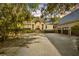 Beautiful exterior view showcasing a well-maintained home, driveway, and attached garage at 65 Surfsong Rd, Kiawah Island, SC 29455