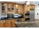 Modern kitchen features custom cabinets, stainless steel appliances and granite countertops at 65 Surfsong Rd, Kiawah Island, SC 29455