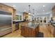Kitchen with custom wood cabinets, stainless appliances and a large kitchen island at 65 Surfsong Rd, Kiawah Island, SC 29455