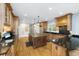 Spacious kitchen with wooden cabinets, granite countertops, and a large center island at 65 Surfsong Rd, Kiawah Island, SC 29455