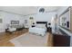 Serene main bedroom with vaulted ceiling, sitting area, and ample natural light from multiple windows at 65 Surfsong Rd, Kiawah Island, SC 29455