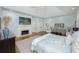 Comfortable main bedroom featuring a fireplace, sitting area, and soft natural light at 65 Surfsong Rd, Kiawah Island, SC 29455