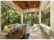 An outdoor kitchen equipped with a stainless steel grill and sink, under a wood ceiling at 65 Surfsong Rd, Kiawah Island, SC 29455