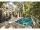 An inviting pool area with outdoor kitchen and comfortable seating at 65 Surfsong Rd, Kiawah Island, SC 29455