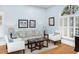 Cozy sitting area with comfortable seating, and natural light from arched windows at 65 Surfsong Rd, Kiawah Island, SC 29455