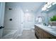 Modern bathroom featuring a double sink vanity, tiled shower, and contemporary fixtures at 676 Sterling Dr, Charleston, SC 29412