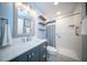 Updated bathroom with tile shower, storage shelves and modern vanity at 676 Sterling Dr, Charleston, SC 29412