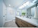 Bright bathroom with double vanity, marble counters, and updated fixtures at 676 Sterling Dr, Charleston, SC 29412