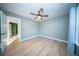 Empty bedroom featuring wood floors, neutral walls and a ceiling fan at 676 Sterling Dr, Charleston, SC 29412