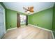 Bedroom with wood floors, neutral walls, ceiling fan and a window at 676 Sterling Dr, Charleston, SC 29412