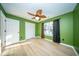 Bedroom with wood floors, window, closet and a ceiling fan at 676 Sterling Dr, Charleston, SC 29412