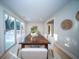 Bright dining space with a large wooden table, seating for six, and a sliding glass door at 676 Sterling Dr, Charleston, SC 29412