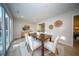 Light-filled dining area features a wood table, comfortable seating, and access to outdoor views at 676 Sterling Dr, Charleston, SC 29412