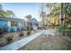 Inviting home with a charming covered porch, a walkway, and a beautifully landscaped front yard at 676 Sterling Dr, Charleston, SC 29412