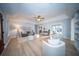 Bright living room with light wood floors, gray sofa, and white chairs offering a cozy and inviting atmosphere at 676 Sterling Dr, Charleston, SC 29412