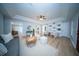 Inviting living room featuring light wood floors, stylish furniture, and a custom-built bookshelf at 676 Sterling Dr, Charleston, SC 29412