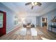 Charming living room with gray sofa, white ottomans and updated lighting at 676 Sterling Dr, Charleston, SC 29412