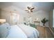 Lovely main bedroom with wood floors, seating area, and open doorway to bath at 676 Sterling Dr, Charleston, SC 29412