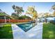 Inviting backyard pool with sleek white tile surround and manicured lawn at 676 Sterling Dr, Charleston, SC 29412