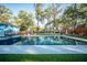 Large backyard pool area with white tiling, perfect for outdoor entertaining and relaxation at 676 Sterling Dr, Charleston, SC 29412