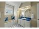 Bathroom featuring a window seat, blue countertop, and well-lit vanity area at 7 West St # C, Charleston, SC 29401