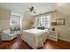 Charming bedroom with hardwood floors, window seat, and neutral color palette at 7 West St # C, Charleston, SC 29401