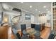 Cozy breakfast nook adjacent to kitchen features hardwood floors and modern decor at 7 West St # C, Charleston, SC 29401