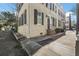 Street view of a charming home with black shutters and inviting entryway at 7 West St # C, Charleston, SC 29401