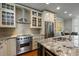 Updated kitchen with granite countertops, stainless steel appliances, and stylish cabinetry at 7 West St # C, Charleston, SC 29401