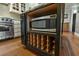Kitchen island features a microwave, wine storage and a countertop with lots of prep space at 7 West St # C, Charleston, SC 29401
