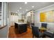 Gourmet kitchen includes a center island with granite countertops, custom cabinets, and stainless steel appliances at 7 West St # C, Charleston, SC 29401
