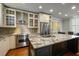 Well-equipped kitchen features a stainless steel Viking range, granite counters, and ample storage at 7 West St # C, Charleston, SC 29401