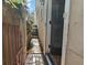 Narrow side entrance with brick walkway leading to the back entrance of the house at 7 West St # C, Charleston, SC 29401