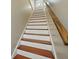 Well-maintained staircase with a wooden railing and clean white risers at 7 West St # C, Charleston, SC 29401