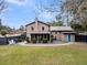 Aerial view of a house with a well-manicured lawn, garden, patio, and fenced perimeter at 739 Shamrock Ln, Charleston, SC 29412