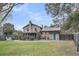 Scenic backyard with a well-manicured lawn, stone patio, and charming outdoor entertaining space at 739 Shamrock Ln, Charleston, SC 29412