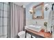 Classic bathroom with a stylish vessel sink and wood-trimmed mirror at 739 Shamrock Ln, Charleston, SC 29412