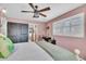 Bright bedroom featuring a comfortable bed, ceiling fan, and natural light at 739 Shamrock Ln, Charleston, SC 29412