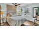 Cozy bedroom featuring wood accent wall and natural light at 739 Shamrock Ln, Charleston, SC 29412