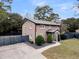 Beautiful two-story home with manicured landscaping, metal roof, and a spacious driveway at 739 Shamrock Ln, Charleston, SC 29412