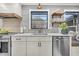Bright and airy kitchen featuring updated appliances, sleek countertops, and stylish open shelving at 739 Shamrock Ln, Charleston, SC 29412