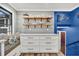 Bright kitchen featuring a window seat, open shelving and white cabinets at 739 Shamrock Ln, Charleston, SC 29412
