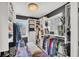 Walk-in closet featuring custom shelving, and an elegant chandelier at 739 Shamrock Ln, Charleston, SC 29412
