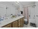 Full bathroom with double sink vanity, a shower-tub combo and updated fixtures at 7900 Shadow Oak Dr Dr, North Charleston, SC 29406