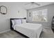 Comfortable bedroom features a light color palette, bright window, and ceiling fan at 7900 Shadow Oak Dr Dr, North Charleston, SC 29406