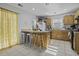 Bright kitchen features a breakfast bar with seating and lots of cabinet space at 7900 Shadow Oak Dr Dr, North Charleston, SC 29406