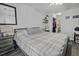Bright bedroom featuring laminate floors, a ceiling fan, and ample natural light at 7900 Shadow Oak Dr Dr, North Charleston, SC 29406
