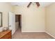 Neutral-toned bedroom with a ceiling fan and doorway leading out to a carpeted landing at 81 Branch Creek Trl, Summerville, SC 29483